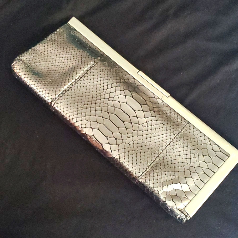 Calvin Klein clutch, silver/chrome, reptile pattern.